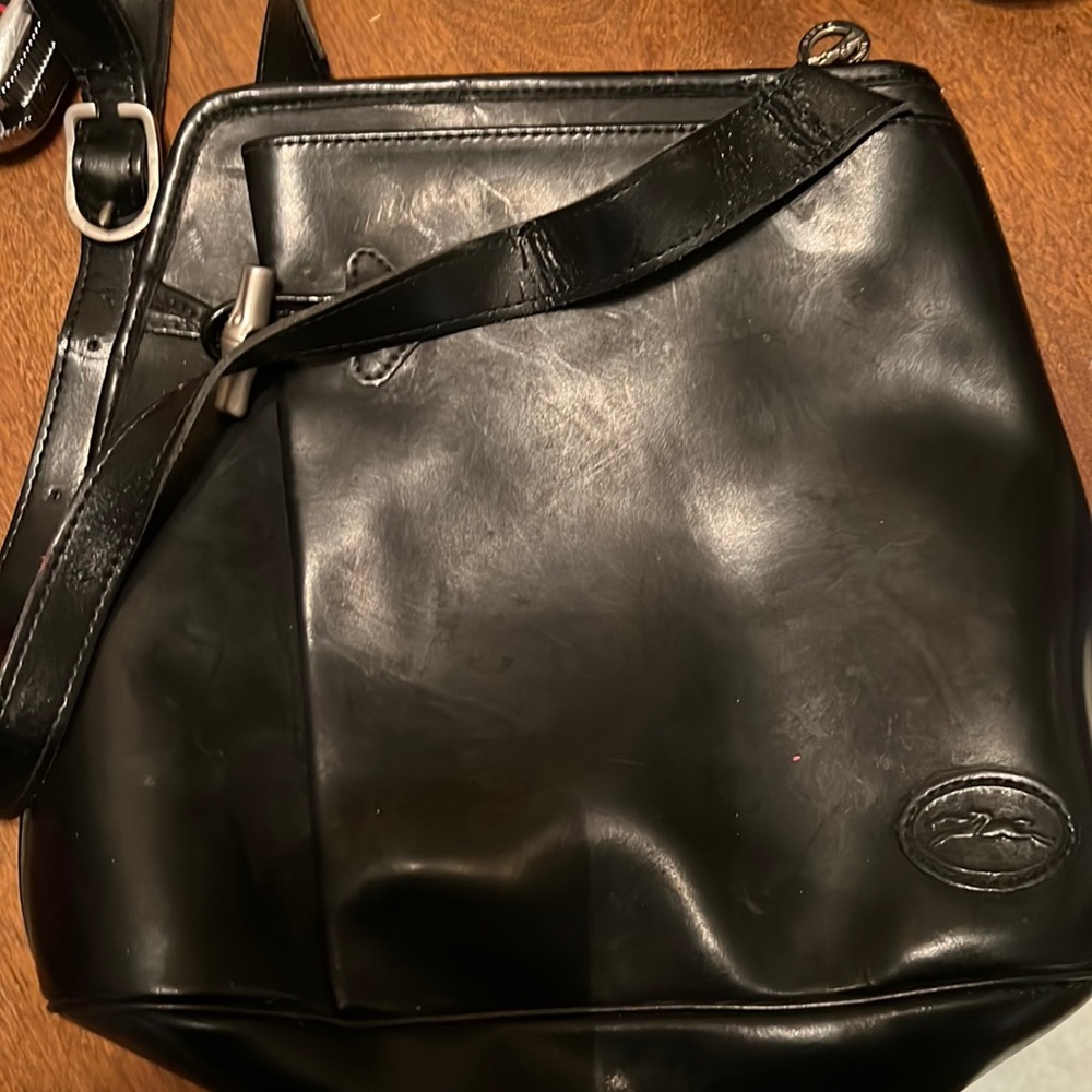 Longchamp black leather shoulder bag.